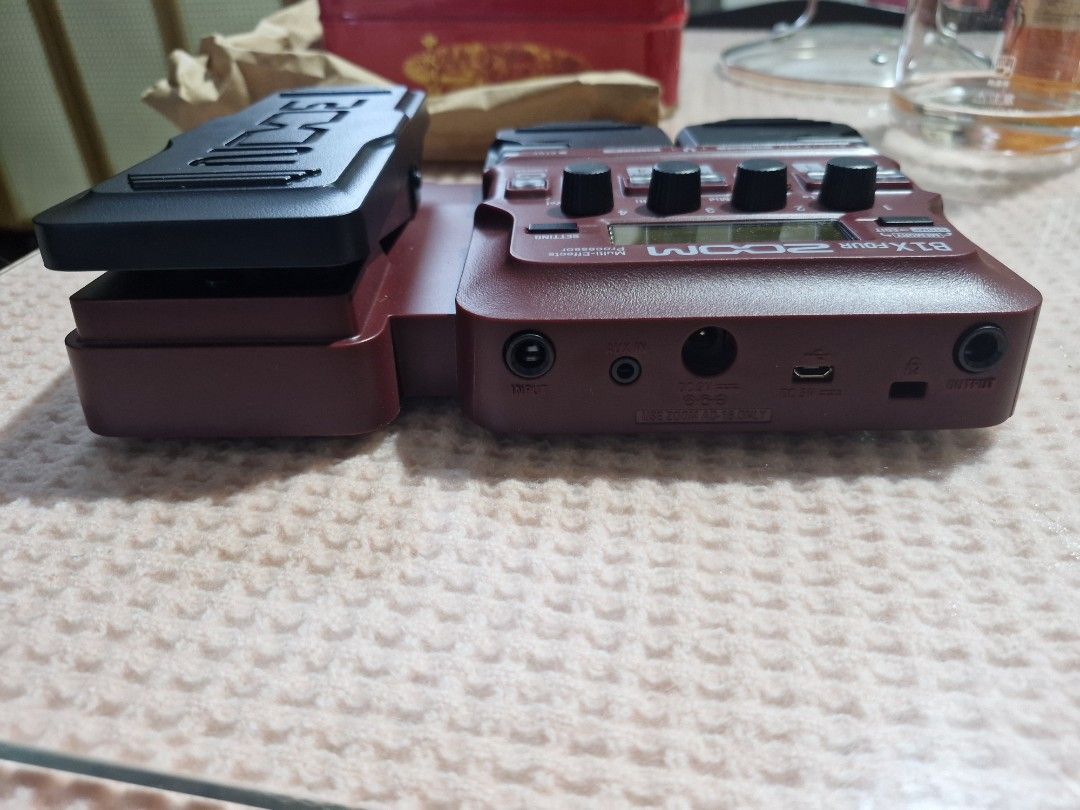 Zoom B1X Four Bass Multi-Effects with Expression Pedal (Category: Musical Instruments) located in Manila. Submitted by tigasorda61186 (Listing ID 1468751373, Image 2). Description: - Model: Zoom B1X Four Bass Multi-Effects Pedal - Color: Vibrant red chassis with black expression pedal and buttons - Features: Built-in expression pedal, diverse rhythm patterns, and looper function - Connectivity: Input, Aux-in, DC 5V, USB, and Output ports - Inclus