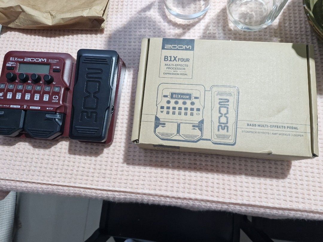 Zoom B1X Four Bass Multi-Effects with Expression Pedal (Category: Musical Instruments) located in Manila. Submitted by tigasorda61186 (Listing ID 1468751373, Image 3). Description: - Model: Zoom B1X Four Bass Multi-Effects Pedal - Color: Vibrant red chassis with black expression pedal and buttons - Features: Built-in expression pedal, diverse rhythm patterns, and looper function - Connectivity: Input, Aux-in, DC 5V, USB, and Output ports - Inclus