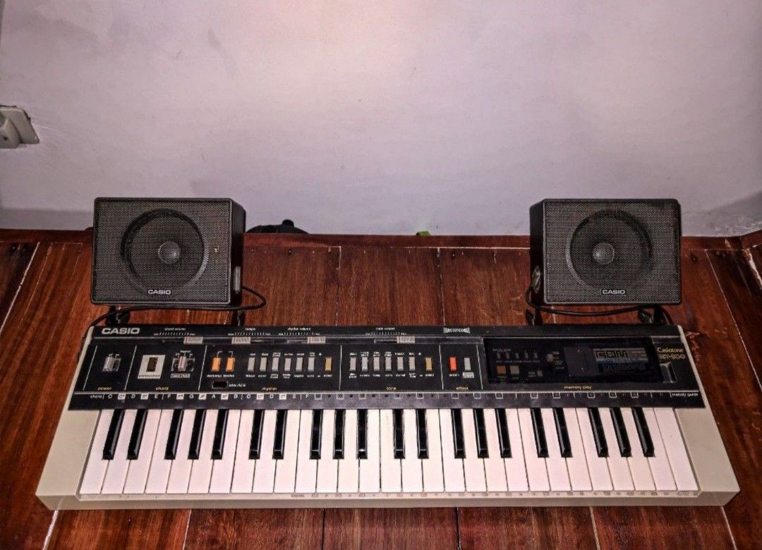 1983 Casiotone Keyboard Synthesizer (Category: Musical Instruments) located in General Trias. Submitted by mervcorner (Listing ID 1469160717, Image 1). Description: Casio Vintage Keyboard Synthesizer Model: Casiotone MT-800 (1983) Features: 49 mini-key keyboard (4 octaves) 12 preset instrument voices 12 rhythm patterns with intro/fill functions Casio Chord accompaniment mode Built-in sequencer/song memory Melody Guide system with LED key indicato