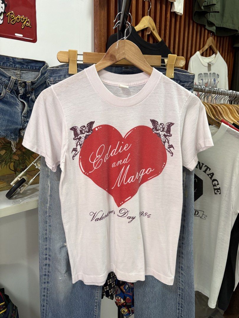 1984 Valentine’s Day tee. (Category: Tshirts & Polo Shirts ) located in Paranaque City. Submitted by arcvintage (Listing ID 1469005133, Image 1). Description: 1984 Valentine’s Day tee. Size: Fits Small Chest: 17” Length: 24” Flaws: Paper thin Fabric Color rate: 9.5/10 P1000 plus shipping fee. Sizing is determined by measurements not by the garment tag. Disclaimer: Arc Vintage is not affiliated with the official brand’s displayed. All rights to th