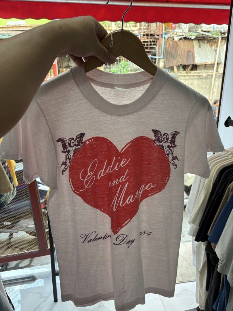 1984 Valentine’s Day tee. (Category: Tshirts & Polo Shirts ) located in Paranaque City. Submitted by arcvintage (Listing ID 1469005133, Image 3). Description: 1984 Valentine’s Day tee. Size: Fits Small Chest: 17” Length: 24” Flaws: Paper thin Fabric Color rate: 9.5/10 P1000 plus shipping fee. Sizing is determined by measurements not by the garment tag. Disclaimer: Arc Vintage is not affiliated with the official brand’s displayed. All rights to th