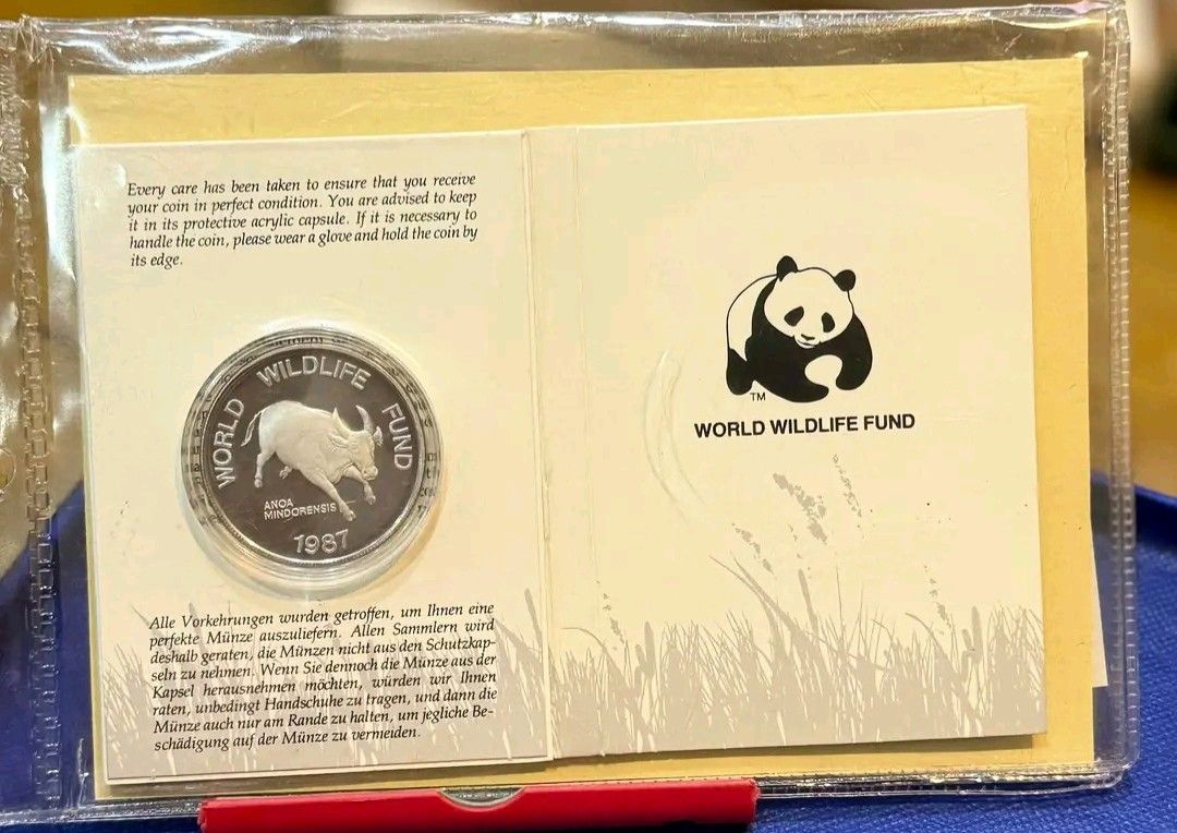 1987 Philippines Tamarau Anoa Mindorensis WWF Commemorative Silver Proof Coin COA (Category: Currency) located in Baliuag. Submitted by rain_me (Listing ID 1469088499, Image 1). Description: - Official WWF 25th Anniversary commemorative coin released in 1987 - Features the endangered Tamarau (Anoa mindorensis) native to Mindoro, Philippines - Stunning proof finish silver coin sealed in its original protective acrylic capsule - Includes the offici