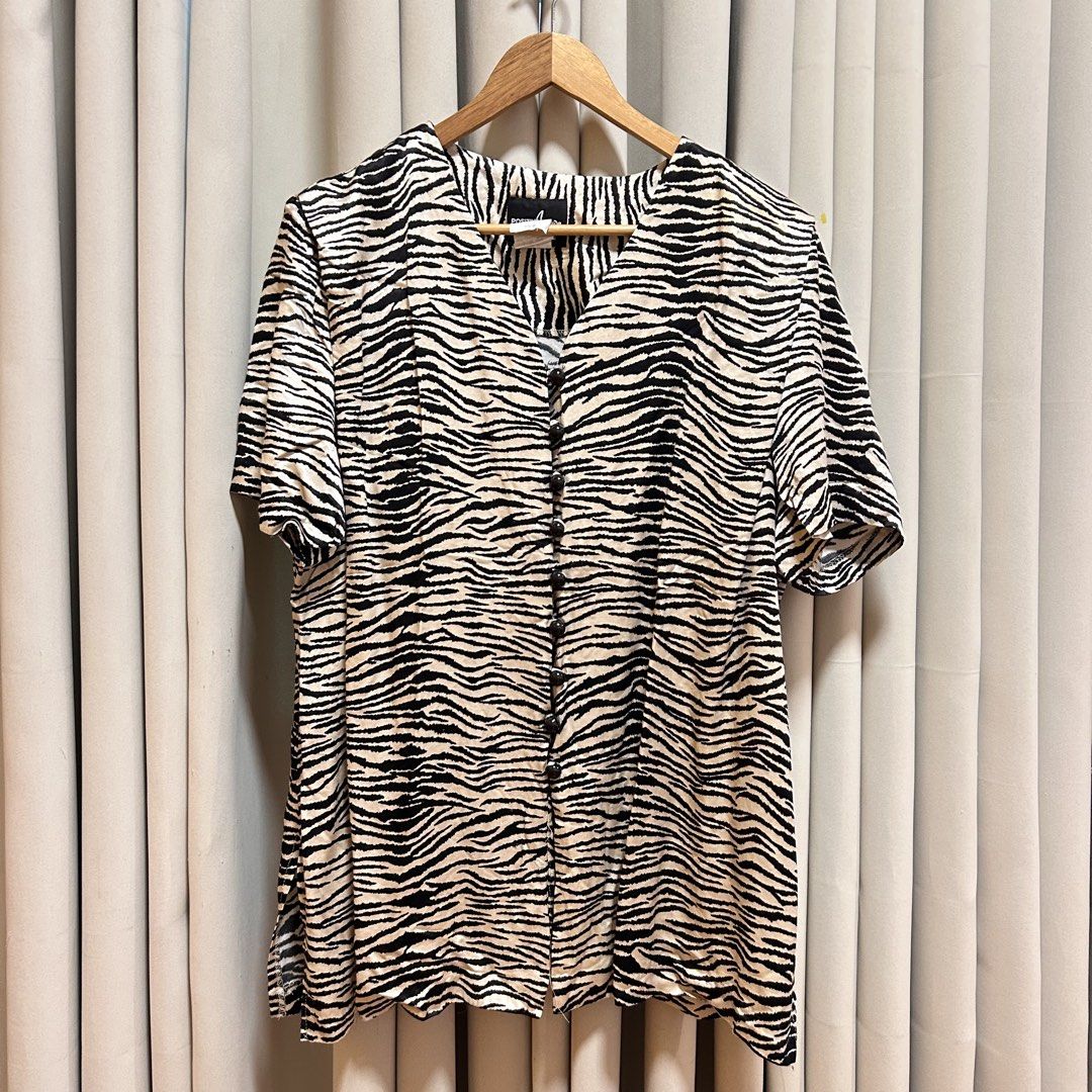 2XL Zebra Print Top (Category: Blouses) located in Rizal. Submitted by from99abovecloset (Listing ID 1468976753, Image 1). Description: CODE:177 Size: 2XL Armhole (laid flat):12” Bust (around): 52” Length (laid flat): 30” Cotton rayon | loose | with light stain .