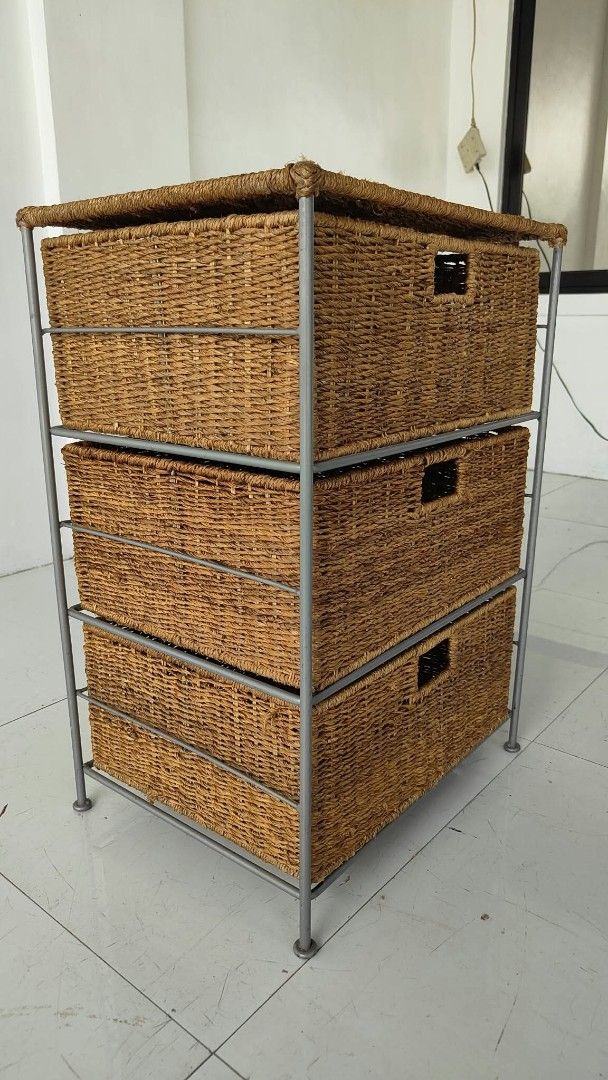 3-Tier Wicker Basket Storage Unit with Metal Frame (Category: Shelves, Cabinets & Racks) located in Manila. Submitted by roveeeeelen_06 (Listing ID 1469085034, Image 1). Description: - Set of 3 woven wicker baskets in a sturdy grey metal frame - Built-in cut-out handles for smooth and easy pulling - Flat top surface offers extra space for display or decor - Keeps clutter hidden while adding natural texture to your room - Clean condition overall a
