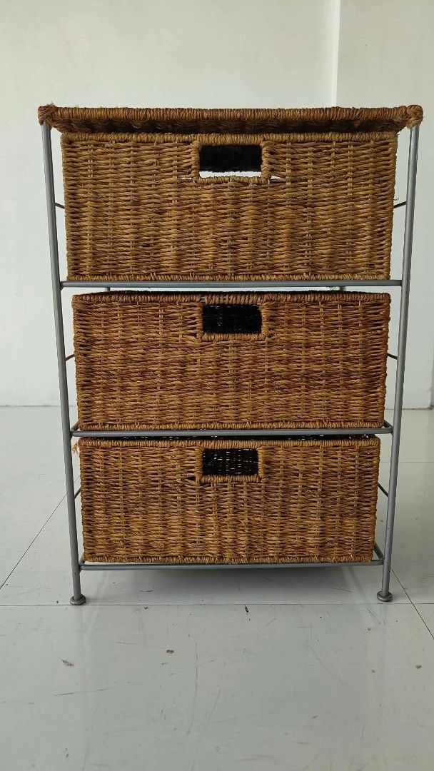 3-Tier Wicker Basket Storage Unit with Metal Frame (Category: Shelves, Cabinets & Racks) located in Manila. Submitted by roveeeeelen_06 (Listing ID 1469085034, Image 2). Description: - Set of 3 woven wicker baskets in a sturdy grey metal frame - Built-in cut-out handles for smooth and easy pulling - Flat top surface offers extra space for display or decor - Keeps clutter hidden while adding natural texture to your room - Clean condition overall a