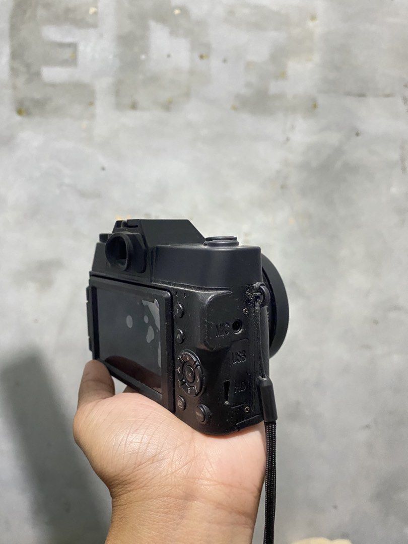 4K Ultra HD Digital Camera with Wide Angle Lens (Category: Cameras) located in General Santos City (Dadiangas). Submitted by jedlmaed54504 (Listing ID 1469014667, Image 2). Description: - 4K Ultra HD digital camera in sleek black - Equipped with a 0.45x super wide-angle lens and lens cap - Convenient built-in flash and top mode dial for easy adjustments - Side ports include microphone, USB, and memory card slot - Includes a secure wrist strap for