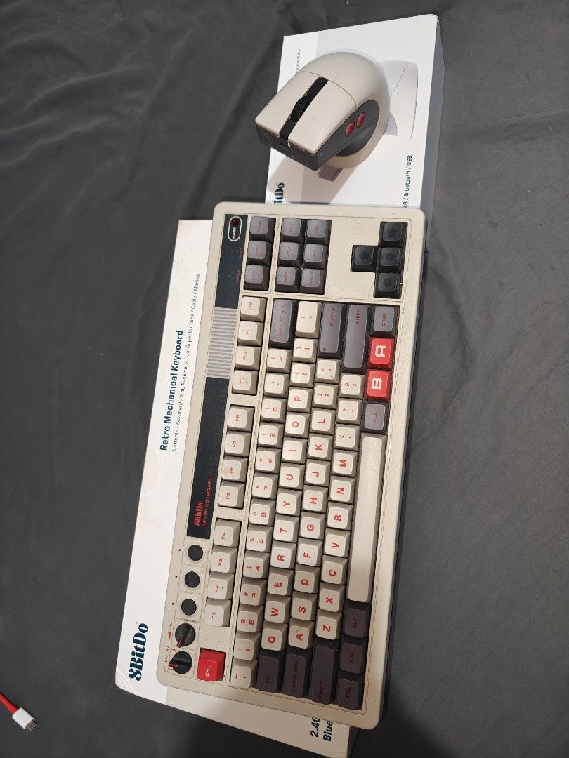8BitDo Retro Mechanical Keyboard and Retro R8 Mouse (Category: Computer Keyboard) located in Tarlac. Submitted by raphocehcap (Listing ID 1469050906, Image 2). Description: - 8BitDo Retro Mechanical Keyboard and matching R8 Mouse - Condition: Like new, unboxed with original packaging included - Design: Classic retro aesthetic in grey and beige with striking red accents - Connectivity: Tri-mode wireless (2.4G, Bluetooth, and wired USB) - Perfect b