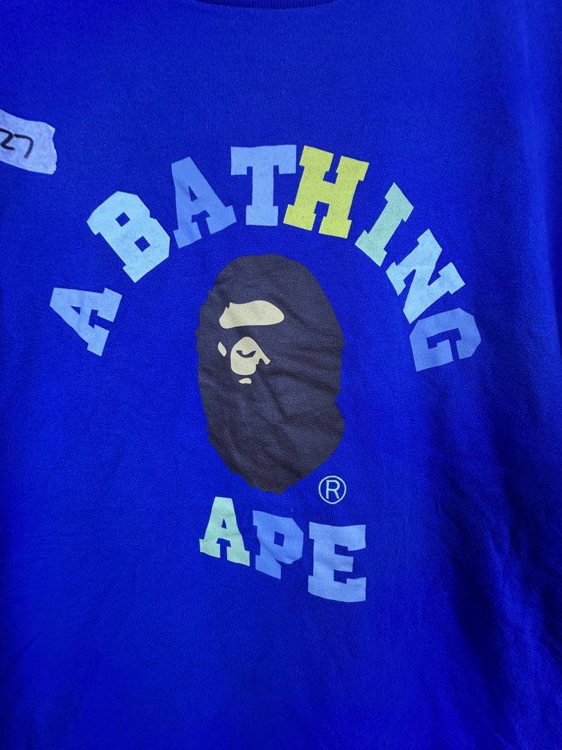 A Bathing Ape Blue Tee Size L (Category: Tshirts & Polo Shirts ) located in Manila. Submitted by declutterpromax (Listing ID 1468970021, Image 2). Description: - Brand: A Bathing Ape (BAPE) - Color: Blue (Solid back) - Size: L (Large) - Dimensions: 21" chest width x 27" length - Details: Large multicolored ape head graphic on front, sleeve logo tag, and classic inner collar tag - Condition: Excellent streetwear piece, ready to wear.