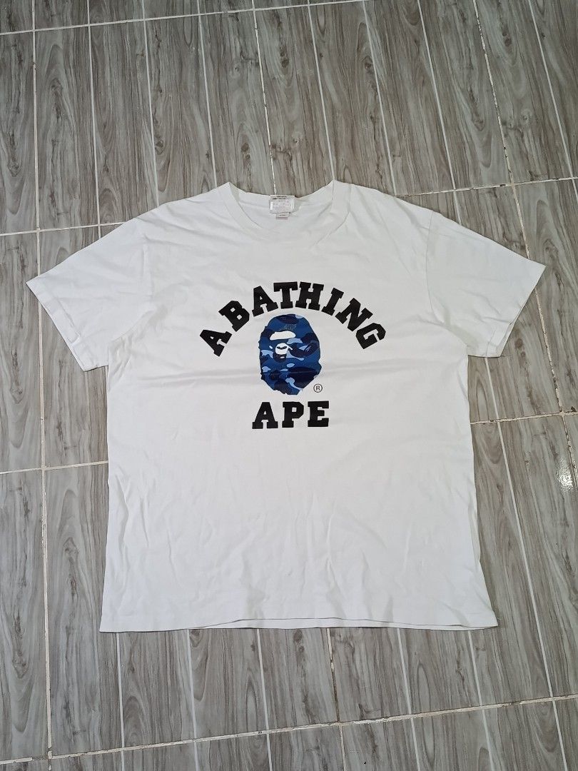 A BATHING APE COLLEGE TSHIRT (freeshipping) (Category: Tshirts & Polo Shirts ) located in Quezon City. Submitted by gyl-stop (Listing ID 1469077066, Image 1). Description: free shipping single stitch all the way 23 x 29 good condi cr: 9.5/10 issue: hairline crack/ OFF ONLY.