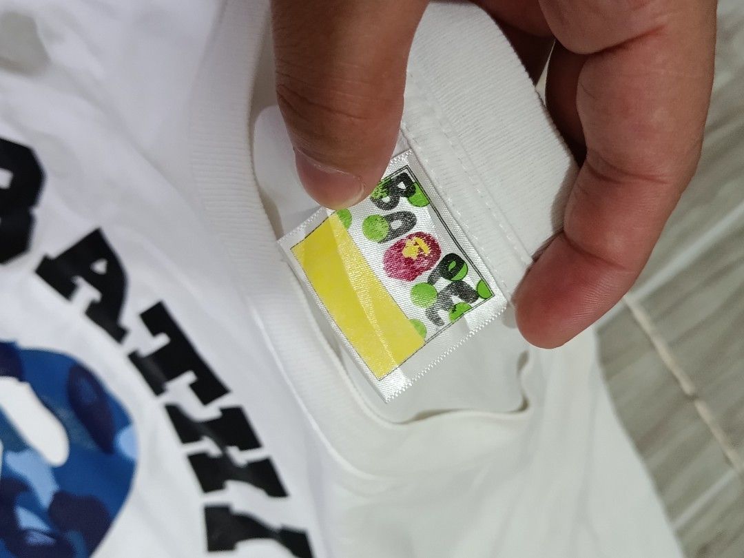 A BATHING APE COLLEGE TSHIRT (freeshipping) (Category: Tshirts & Polo Shirts ) located in Quezon City. Submitted by gyl-stop (Listing ID 1469077066, Image 3). Description: free shipping single stitch all the way 23 x 29 good condi cr: 9.5/10 issue: hairline crack/ OFF ONLY.