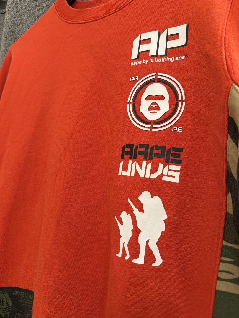 Aape (Authentic) (Category: Coats, Jackets and Outerwear) located in Quezon City. Submitted by macleen17 (Listing ID 1469014242, Image 3). Description: Aape Size M Excellent Condition Red Color Camo Design design Big Sleeve Tag .