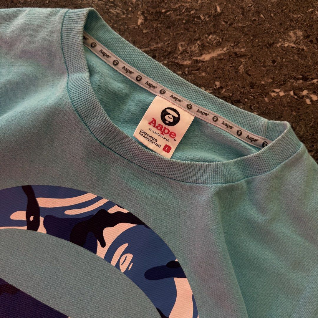 AAPE SHIRT (Category: Activewear) located in Bulacan. Submitted by b4mzz (Listing ID 1469019417, Image 3). Description: Solid condi walang hairlines may minimal pinhole lang nasa pinakadulo ng pic.
