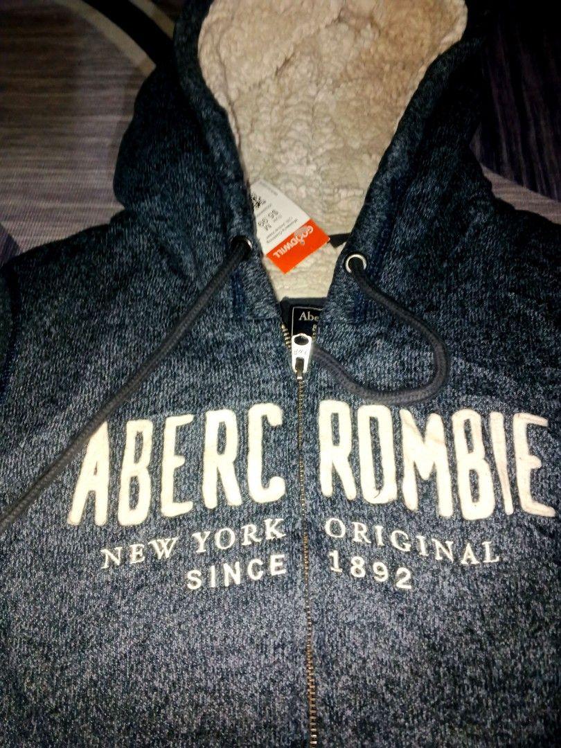Abercrombie hoodie jacket (Category: Coats, Jackets and Outerwear) located in Manila. Submitted by icamalicdem29 (Listing ID 1468940947, Image 2). Description: vintage Abercrombie & Fitch Sherpa Lined Zip-Up Hoodie in heathered navy blue, featuring a fuzzy sherpa fleece lining inside the hood and body with a bold white "Abercrombie" logo spell-out across the chest..