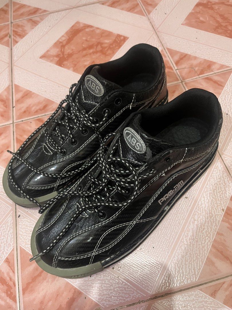 ABS Pro-Am Black Bowling Shoes (Category: Sneakers) located in Pasig City. Submitted by calmfish-776876 (Listing ID 1468981986, Image 2). Description: - Brand/Model: ABS Pro-Am Bowling Shoes - Color: Black with white contrast stitching and striped laces - Protection & Grip: Grey rubber toe caps and durable rubber soles - Ideal For: League nights or casual bowling sessions - Condition: Sturdy build and ready to use.
