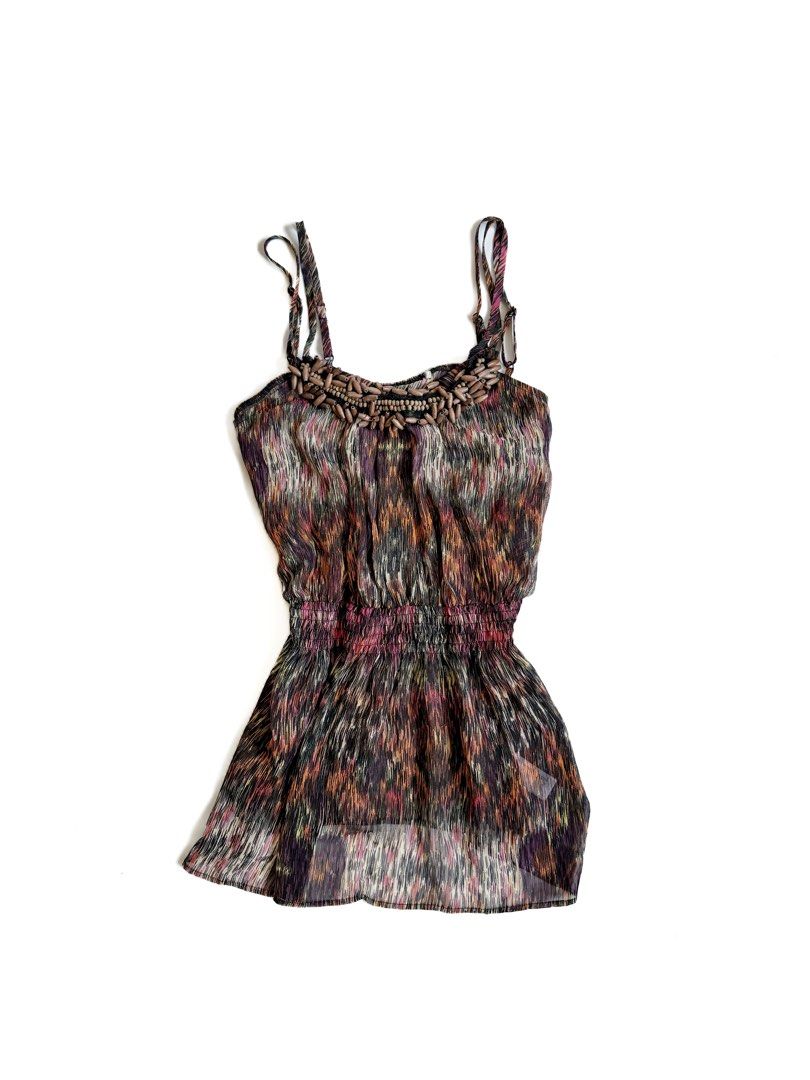 Abstract Print Beaded Halter Tank Top (Category: Sleeveless) located in Tarlac. Submitted by kr_closet (Listing ID 1468934514, Image 1). Description: - Style: Boho multi-color abstract print tank top - Details: Chunky wooden bead embellishment on neckline - Fit: Adjustable spaghetti straps and smocked elastic cinched waist - Design: Lightweight, flowy fabric with a high-low curved hemline.