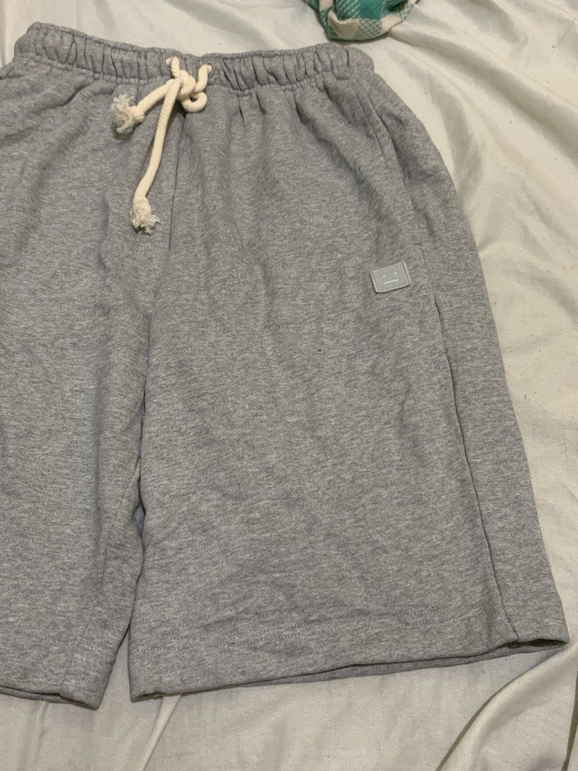 Acne studios gray cotton short for men (Category: Shorts) located in Roxas City. Submitted by vaultcultureco. (Listing ID 1469094388, Image 1). Description: - Brand: Acne Studios - Item: Men's cotton shorts - Color: Gray - Size: S - Material: 100% Cotton (Made in Portugal) - Features: Adjustable drawstring waistband, side pockets, and signature Acne Studios face logo patch - Condition: Excellent pre-owned condition.