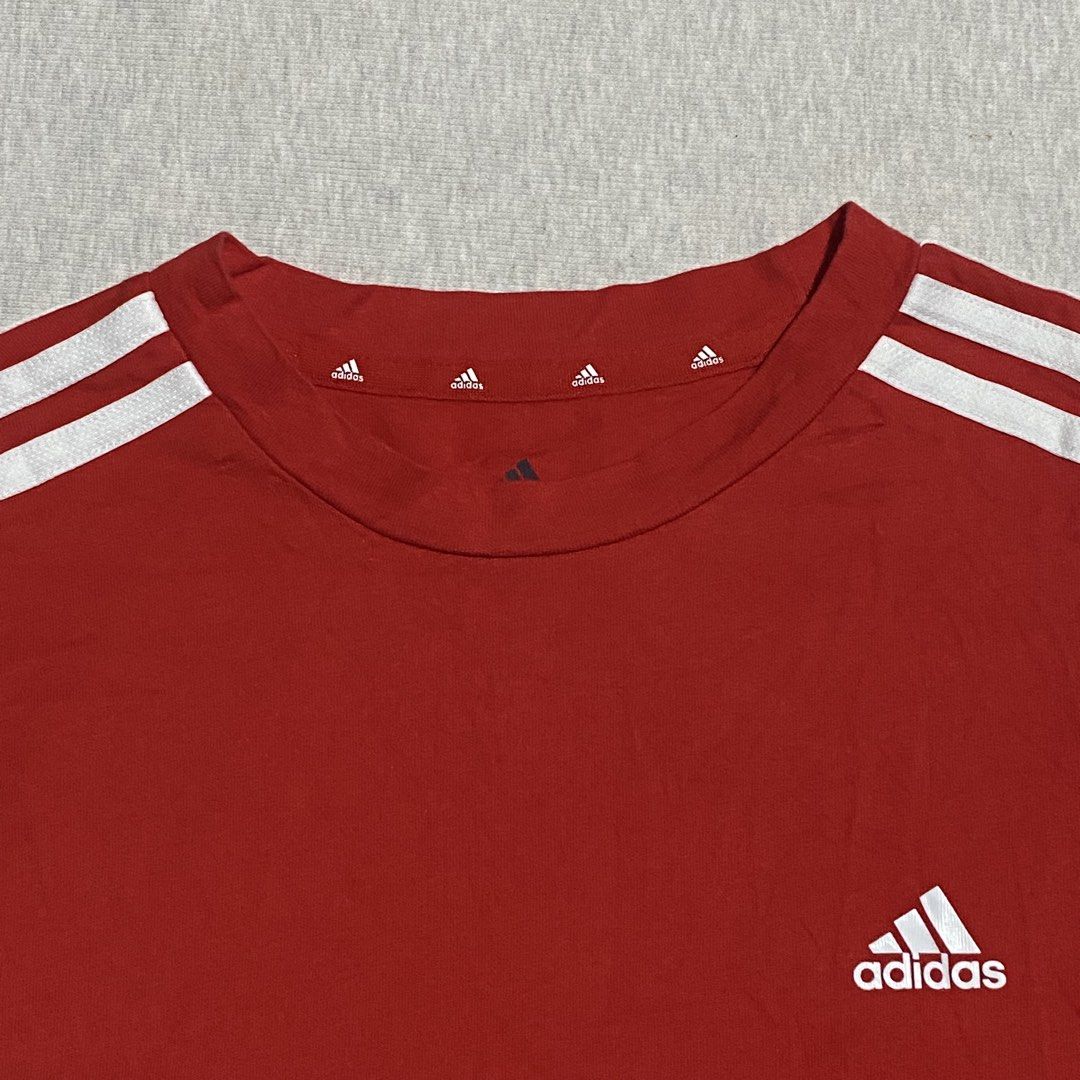 Adidas 3 Lines XS (Category: Shirts) located in Mabalacat. Submitted by stellargarments (Listing ID 1469008732, Image 2). Description: Length : 24 Width : 15 Condition : 9/10 Buong buo logo with 3 lines complete tags red actual color cotton fabric very comfy & smooth on skin medjo lukot pa po need wash no stain fresh from bale only.