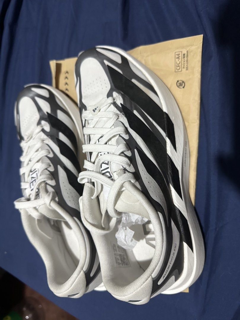 ADIDAS ADIZERO EVO SL EXO (Category: Sneakers) located in Quezon City. Submitted by bart.anonuevo (Listing ID 1468992844, Image 2). Description: - Brand/Model: Adidas Adizero Evo Sl Exo M - Colorway: Cloud White, Core Black, and Iron Metallic - Size: US 8 | UK 7.5 | FR 41 1/3 | JP 260 - Condition: Barely worn, soles have very minor dirt from testing - Features: Lightstrike Pro foam cushioning & Continental rubber outsole BOUGHT IN MACAU ***NO BOX