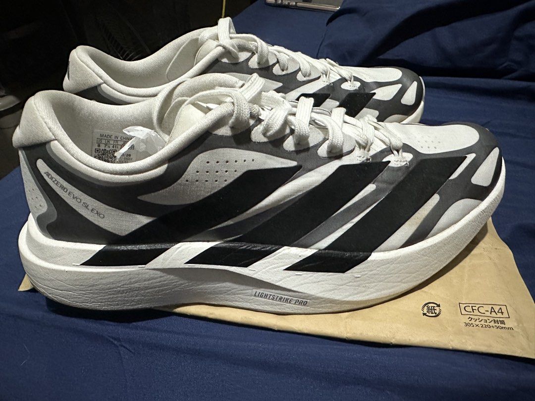 ADIDAS ADIZERO EVO SL EXO (Category: Sneakers) located in Quezon City. Submitted by bart.anonuevo (Listing ID 1468992844, Image 1). Description: - Brand/Model: Adidas Adizero Evo Sl Exo M - Colorway: Cloud White, Core Black, and Iron Metallic - Size: US 8 | UK 7.5 | FR 41 1/3 | JP 260 - Condition: Barely worn, soles have very minor dirt from testing - Features: Lightstrike Pro foam cushioning & Continental rubber outsole BOUGHT IN MACAU ***NO BOX