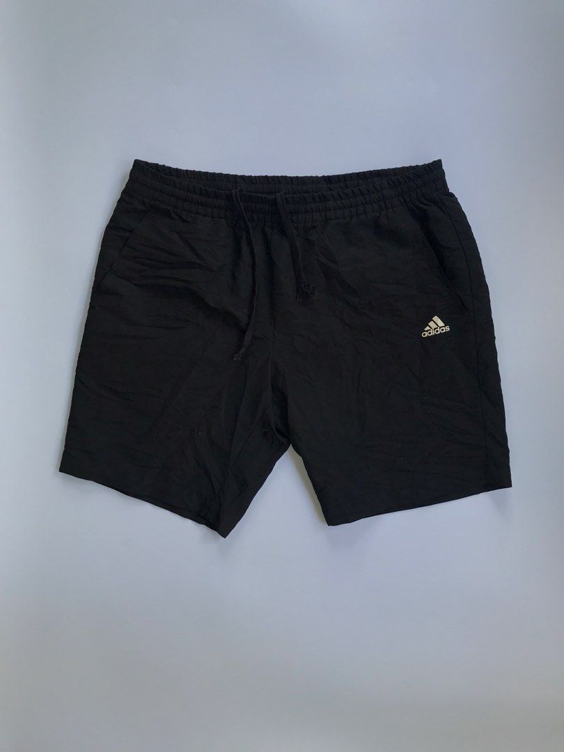 Adidas Black Athletic Shorts with Drawstring (Category: Shorts) located in Manila. Submitted by selme.finds (Listing ID 1468972731, Image 1). Description: - Brand: Adidas - Color: Classic Black - Features: Elastic waistband with adjustable drawstring, convenient side pockets - Design: Small white Adidas logo printed near the hem - Material: Lightweight and breathable, perfect for running, gym workouts, or casual wear - Condition: Good, solid shap