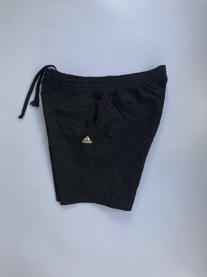 Adidas Black Athletic Shorts with Drawstring (Category: Shorts) located in Manila. Submitted by selme.finds (Listing ID 1468972731, Image 2). Description: - Brand: Adidas - Color: Classic Black - Features: Elastic waistband with adjustable drawstring, convenient side pockets - Design: Small white Adidas logo printed near the hem - Material: Lightweight and breathable, perfect for running, gym workouts, or casual wear - Condition: Good, solid shap