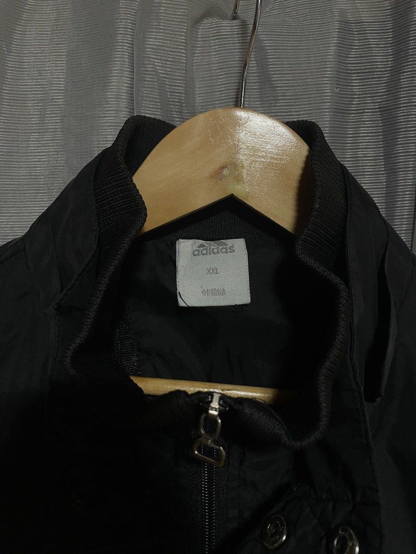 Adidas Black Quilted Windbreaker Jacket XXL (Category: Coats, Jackets and Outerwear) located in Calbayog City. Submitted by thriftme.bro (Listing ID 1469091384, Image 3). Description: Classic black Adidas jacket in size XXL. Features white three-stripe detailing, full zip with snap buttons, and a stylish quilted pattern. Great layering piece for cooler weather. Grab it now!.