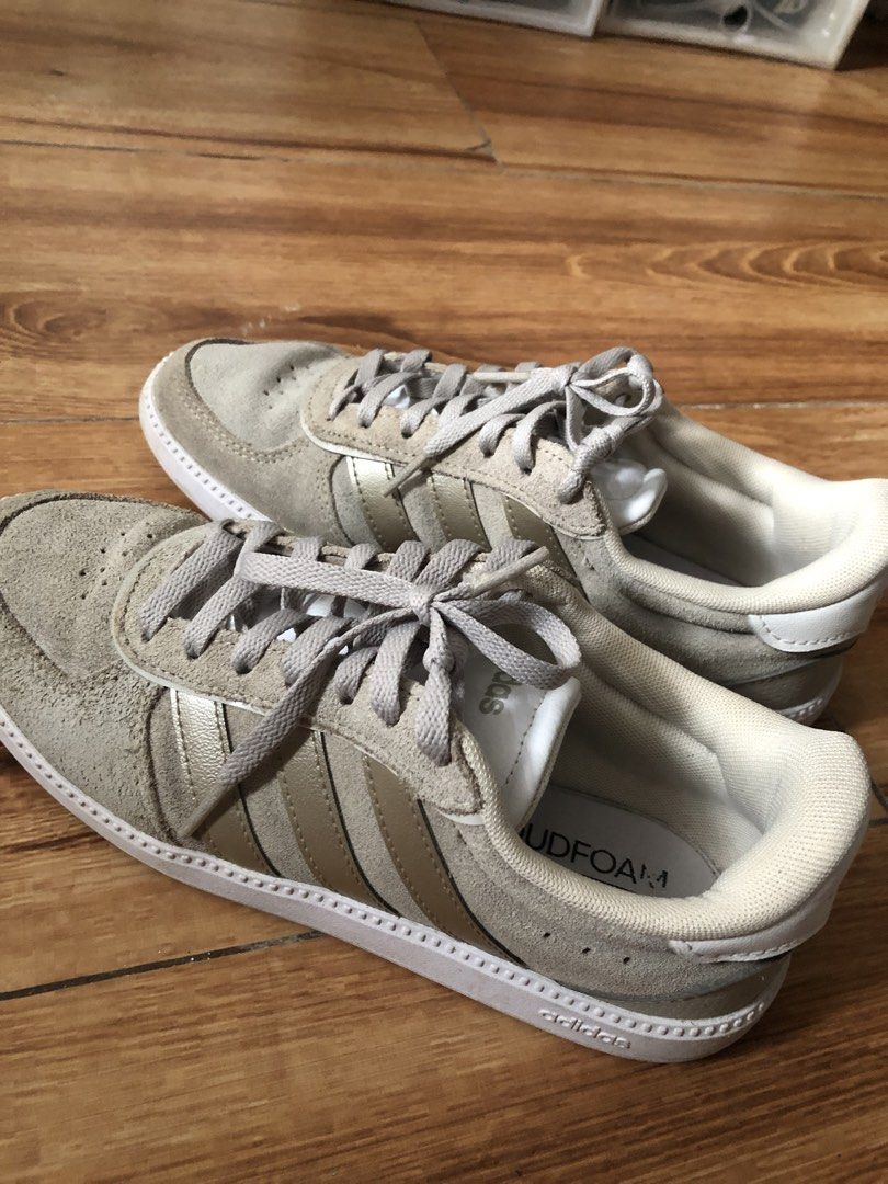 Adidas Cloudfoam Grey and Gold Sneakers (Category: Sneakers) located in Manila. Submitted by crizzy.1101 (Listing ID 1469111882, Image 3). Description: - Brand: Adidas Cloudfoam - Color: Grey suede with gold stripes and white midsole - Comfort: Padded collar, tongue, and Cloudfoam cushioned insoles - Condition: Clean uppers, minimal wear on outsoles - Style: Lace-up, perfect for everyday casual wear.
