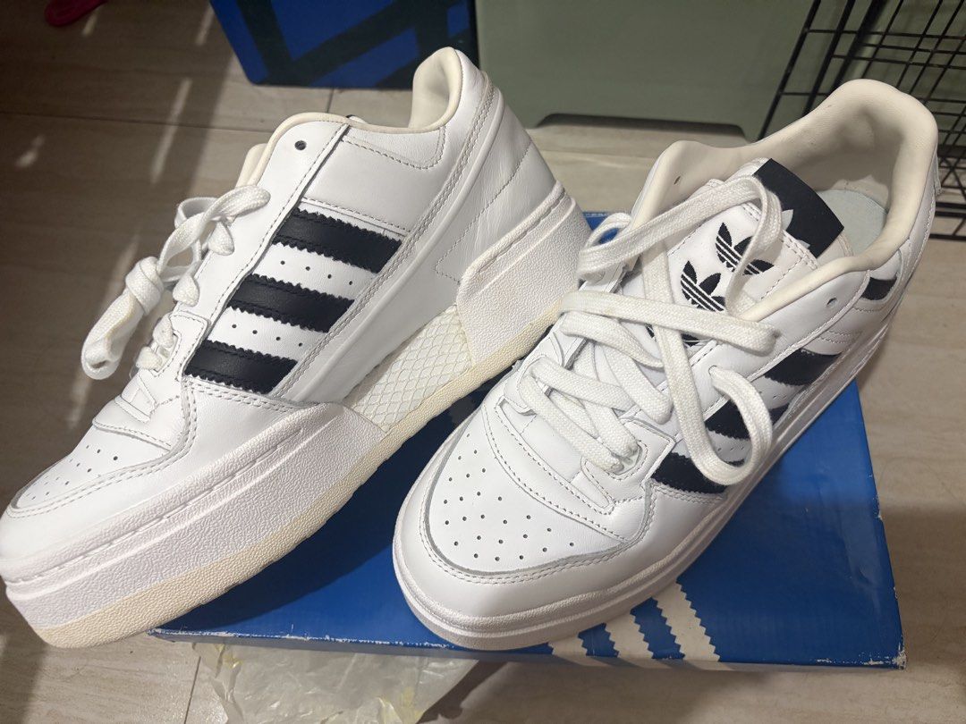 Adidas Forum XLG (Category: Sneakers) located in Manila. Submitted by hannahjac (Listing ID 1468961761, Image 2). Description: - Brand: Adidas - Model: Forum XLG W - Colorway: Classic White and Black with signature three stripes - Size: Women's US 9 / UK 7.5 - Features: Chunky platform sole and lace-up closure - Inclusions: Original blue box included - Condition: Brand new in box (BNIB) damaged na yung box.