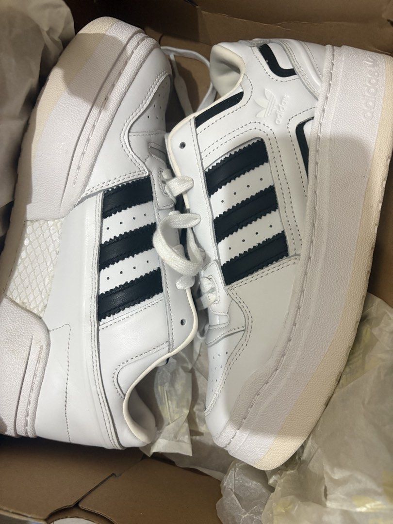 Adidas Forum XLG (Category: Sneakers) located in Manila. Submitted by hannahjac (Listing ID 1468961761, Image 1). Description: - Brand: Adidas - Model: Forum XLG W - Colorway: Classic White and Black with signature three stripes - Size: Women's US 9 / UK 7.5 - Features: Chunky platform sole and lace-up closure - Inclusions: Original blue box included - Condition: Brand new in box (BNIB) damaged na yung box.