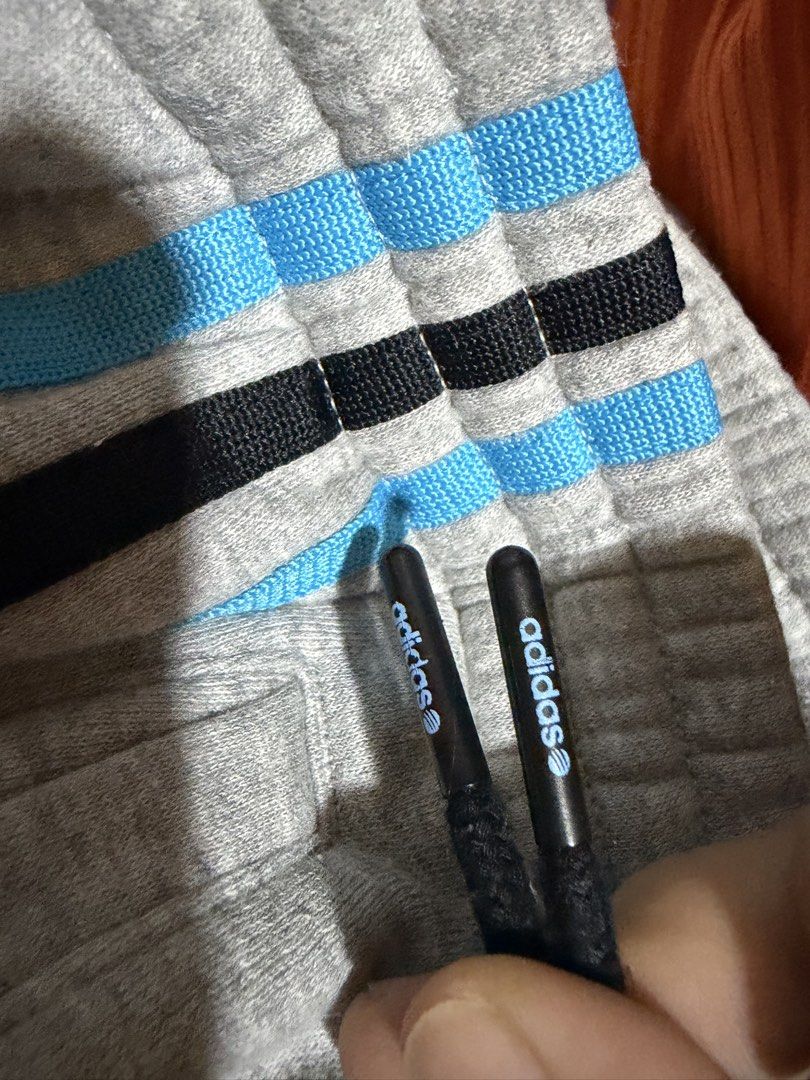 Adidas Neo Label Grey Sweatpants Size M (Category: Activewear) located in Siquijor. Submitted by yhostuff (Listing ID 1469007842, Image 3). Description: - Brand: Adidas Neo Label - Item: Sweatpants with blue & black side stripes - Size: M (175/80A) - Details: Drawstring waistband with branded tips, embroidered logo near front pocket - Condition: Good, with a small ( WASHABLE )stain on the left leg near the logo. P.S. Visit my listing add another 