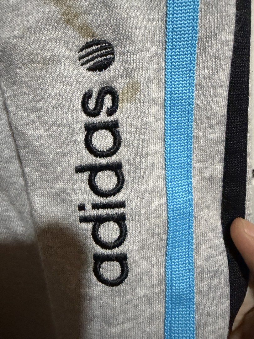 Adidas Neo Label Grey Sweatpants Size M (Category: Activewear) located in Siquijor. Submitted by yhostuff (Listing ID 1469007842, Image 1). Description: - Brand: Adidas Neo Label - Item: Sweatpants with blue & black side stripes - Size: M (175/80A) - Details: Drawstring waistband with branded tips, embroidered logo near front pocket - Condition: Good, with a small ( WASHABLE )stain on the left leg near the logo. P.S. Visit my listing add another 