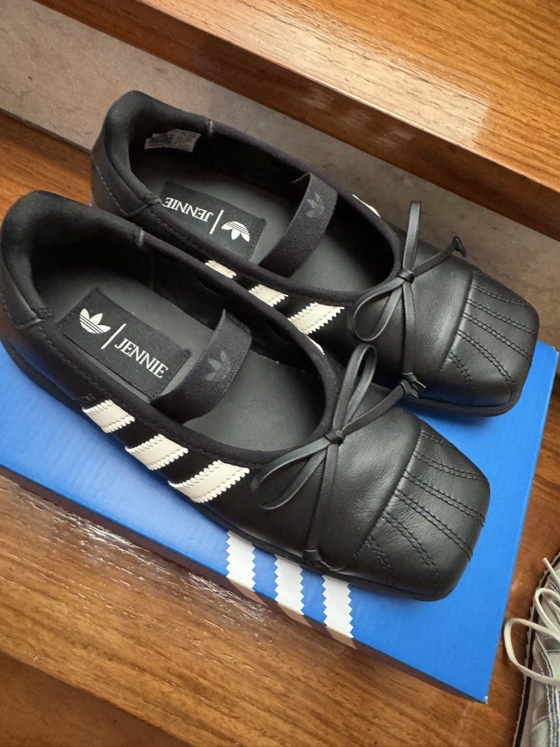 Adidas Superstar Jennie (Category: Sneakers) located in Quezon City. Submitted by AnjRawa (Listing ID 1468932462, Image 2). Description: - Brand: Adidas Superstar SQ Ballet - Color: Core Black and White - Size: US 6 / UK 4.5 / EUR 37 1/3 / JPN 230 - Condition: Brand new, never worn - Style: Slip-on design with elastic strap and cute ribbon bow on the toe cap, combining classic shell-toe and ballet flat aesthetics - Inclusions: Original box and ex