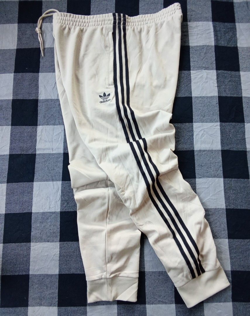 Adidas Trefoil Track Pants (Category: Activewear) located in Polomolok. Submitted by timog_high_ice (Listing ID 1468966787, Image 1). Description: - Beige Color - 3 strips at side - Minimal lints - Waist 33-36 - Length 39 Ang Ganda nito ❤️.