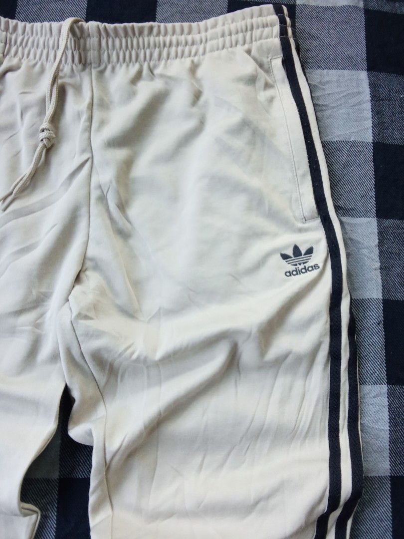 Adidas Trefoil Track Pants (Category: Activewear) located in Polomolok. Submitted by timog_high_ice (Listing ID 1468966787, Image 3). Description: - Beige Color - 3 strips at side - Minimal lints - Waist 33-36 - Length 39 Ang Ganda nito ❤️.