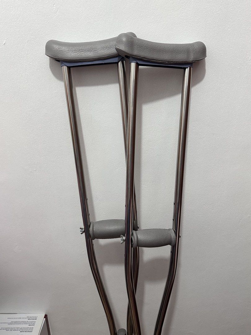 Adjustable Aluminum Underarm Crutches Pair (Category: Medical Supplies & Tools) located in Manila. Submitted by sncrl (Listing ID 1468950615, Image 3). Description: - Pair of sturdy, lightweight aluminum underarm crutches - Comfortable grey padded armrests and handgrips - Easy push-button height adjustment on lower shafts - Slip-resistant rubber tips for safe walking support - Clean condition and fully functional, ideal for injury recovery and re
