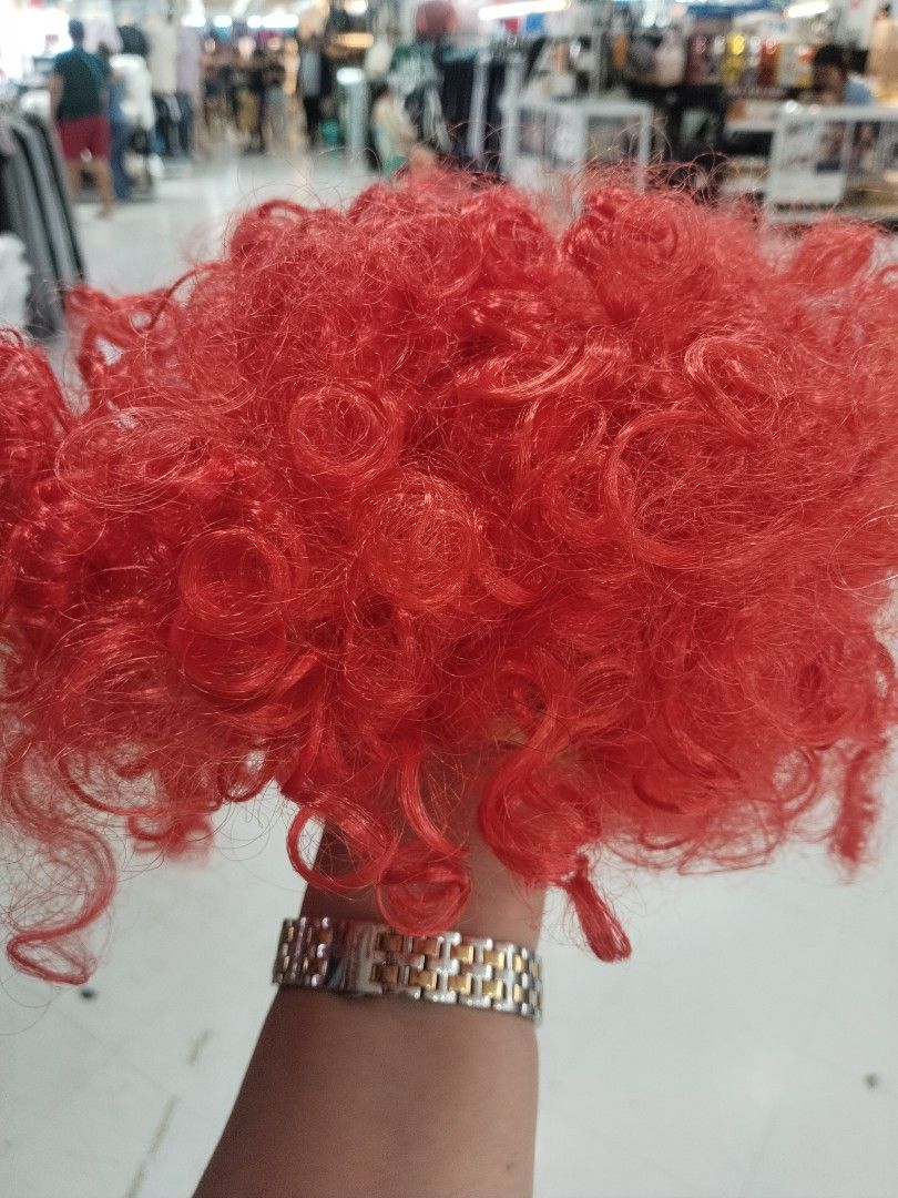 Afro Wig (Category: Hair Accessories) located in Manila. Submitted by zdmal (Listing ID 1468963308, Image 1). Description: - Vibrant bright red curly wig with maximum volume and fluffy texture - Ideal for costumes, cosplay, themed parties, and fun events - Easy to put on and style for a hassle-free look - Lightweight and comfortable to wear.