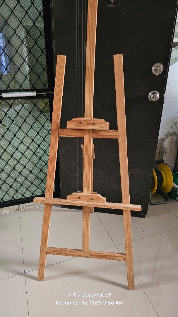 Albeecy Wooden Art Easel Stand (Category: Art & Prints) located in Dasmarinas. Submitted by jazvielle (Listing ID 1469085202, Image 2). Description: - Brand/Model: Albeecy Wooden Art Easel - Material: Solid wood with natural grain finish - Features: Adjustable height setup with secure screw fasteners - Structure: Stable tripod frame, ideal for canvases and drawing boards - Storage: Folds completely flat when not in use.