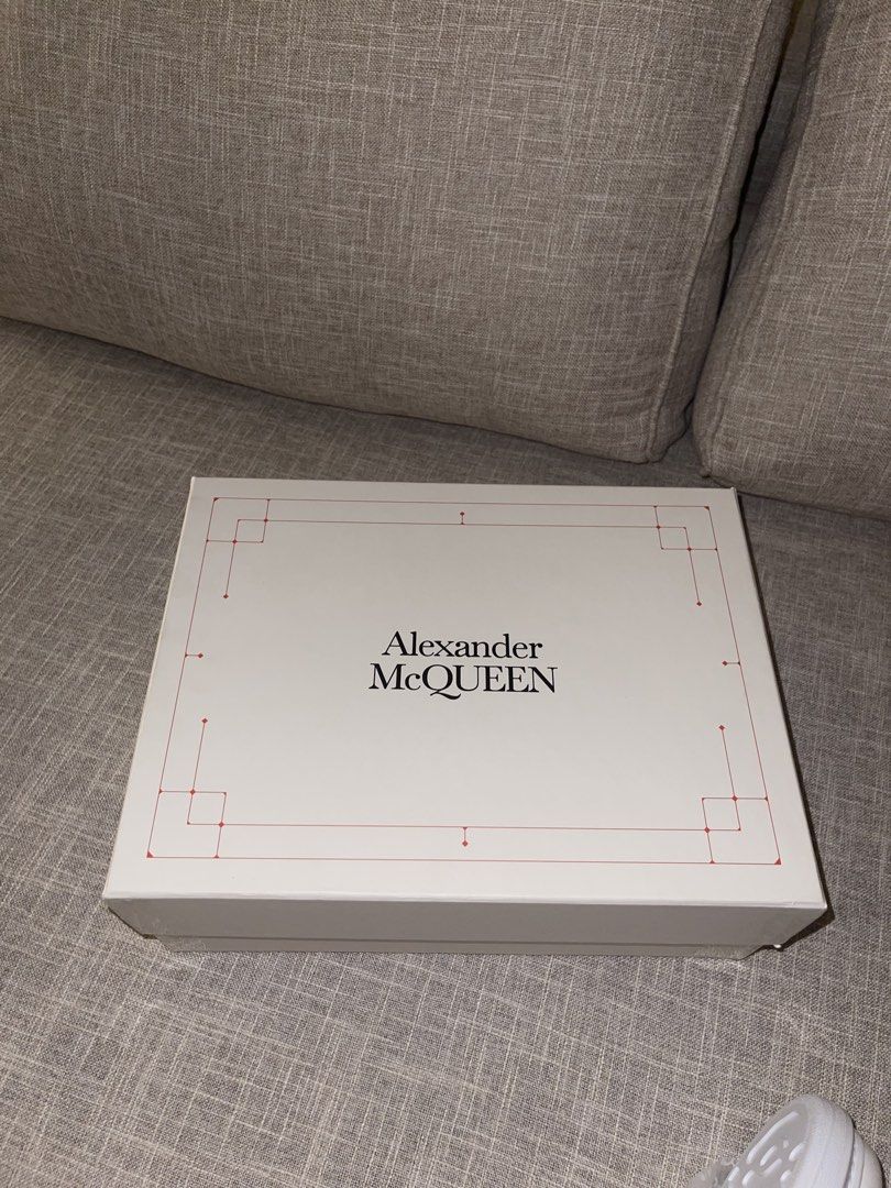 Alexander McQueen Oversized Sneaker White (Category: Sneakers) located in Quezon City. Submitted by cess1024 (Listing ID 1468930518, Image 3). Description: Alexander McQueen chunky white leather sneakers. Thick platform sole, lace-up front, gold embossed logo lettering on the heel tab. Extra pair of thick flat laces included inside the branded dust paper and original box. Clean white leather upper, zero creases visible on the toe box. Crisp soles