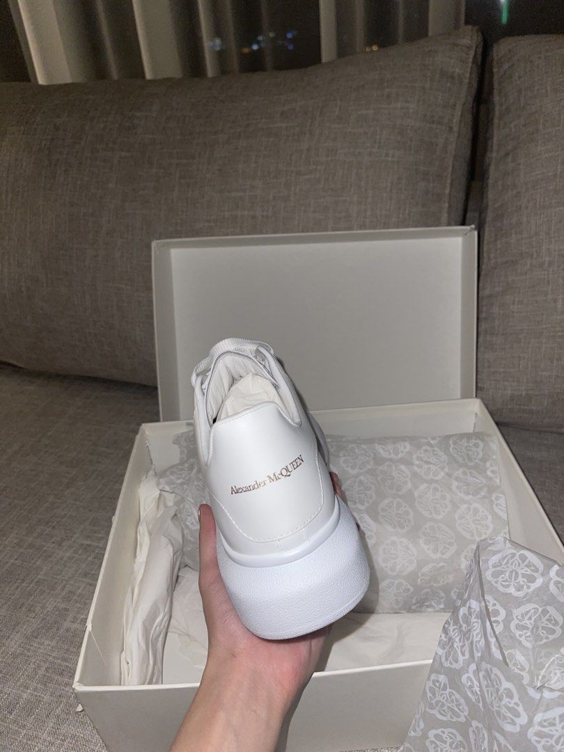 Alexander McQueen Oversized Sneaker White (Category: Sneakers) located in Quezon City. Submitted by cess1024 (Listing ID 1468930518, Image 2). Description: Alexander McQueen chunky white leather sneakers. Thick platform sole, lace-up front, gold embossed logo lettering on the heel tab. Extra pair of thick flat laces included inside the branded dust paper and original box. Clean white leather upper, zero creases visible on the toe box. Crisp soles