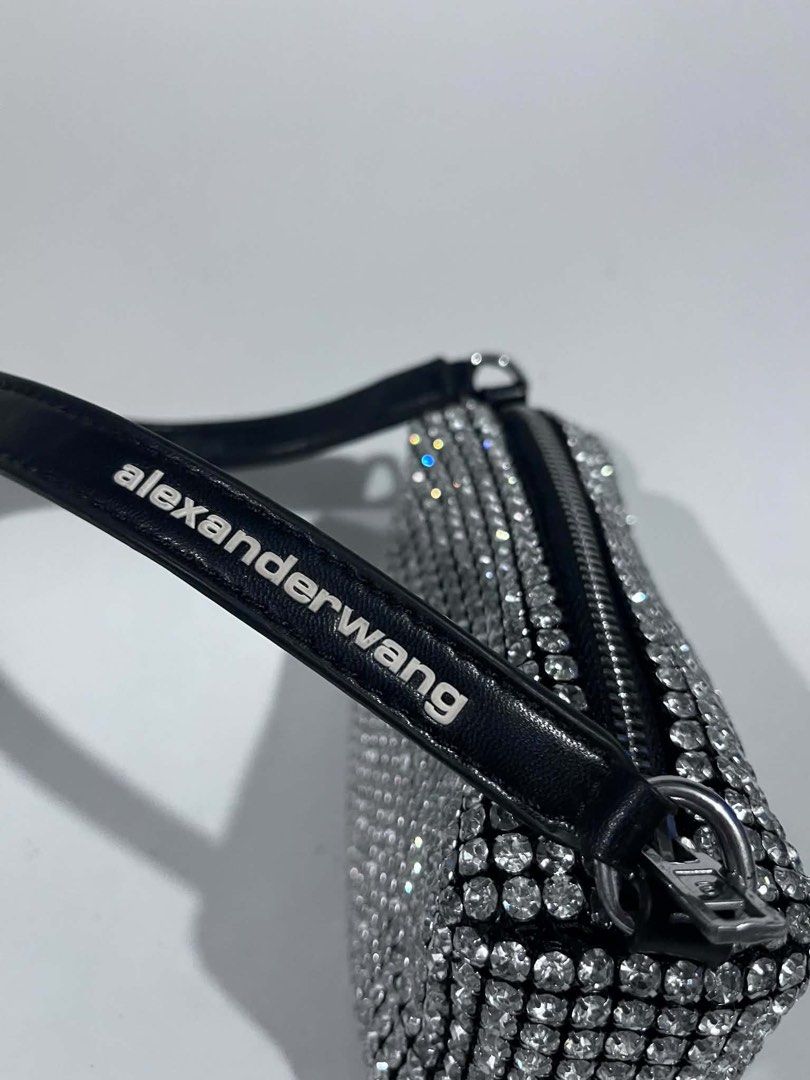 Alexander Wang Rhinestone Mini Bag (Category: Purses & Pouches) located in Dagupan City. Submitted by fahionista1988 (Listing ID 1469044640, Image 3). Description: - Brand: Alexander Wang - Style: Crystal rhinestone mini handbag - Color/Design: Black with sparkling rhinestones and white logo-print shoulder strap - Hardware: Silver-tone with top zip closure - Occasion: Ideal statement piece for parties, events, and nights out - Size: Compact, fits