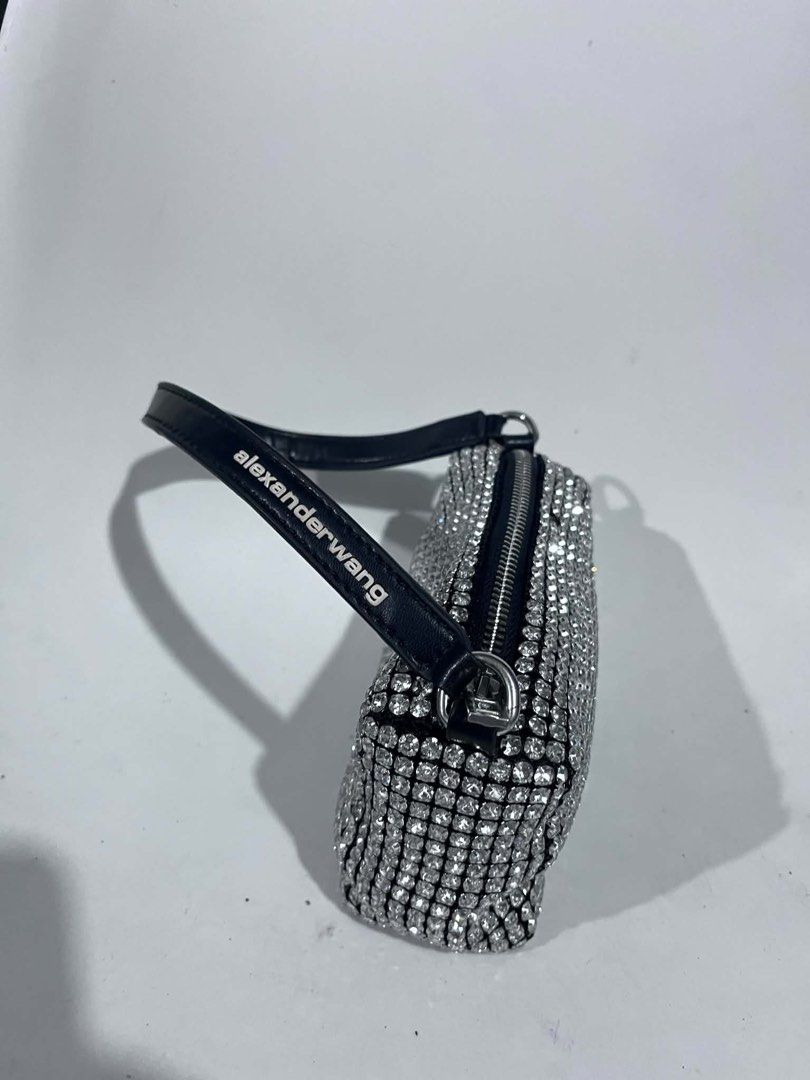 Alexander Wang Rhinestone Mini Bag (Category: Purses & Pouches) located in Dagupan City. Submitted by fahionista1988 (Listing ID 1469044640, Image 2). Description: - Brand: Alexander Wang - Style: Crystal rhinestone mini handbag - Color/Design: Black with sparkling rhinestones and white logo-print shoulder strap - Hardware: Silver-tone with top zip closure - Occasion: Ideal statement piece for parties, events, and nights out - Size: Compact, fits