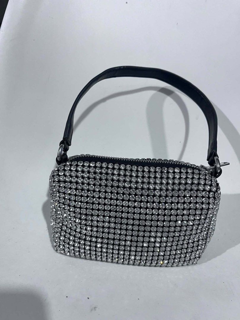 Alexander Wang Rhinestone Mini Bag (Category: Purses & Pouches) located in Dagupan City. Submitted by fahionista1988 (Listing ID 1469044640, Image 1). Description: - Brand: Alexander Wang - Style: Crystal rhinestone mini handbag - Color/Design: Black with sparkling rhinestones and white logo-print shoulder strap - Hardware: Silver-tone with top zip closure - Occasion: Ideal statement piece for parties, events, and nights out - Size: Compact, fits