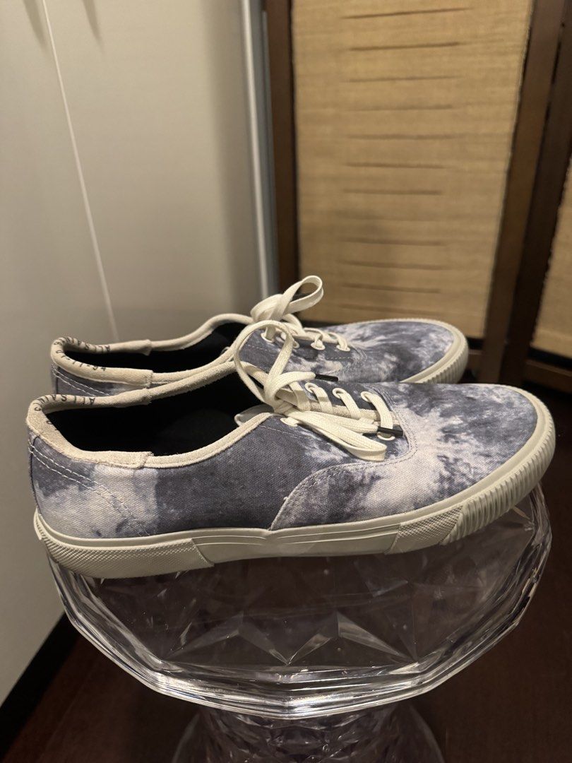 AllSaints Tie-Dye Canvas Sneakers Size 44 (Category: Sneakers) located in Pateros City. Submitted by dependingonvibe (Listing ID 1469003671, Image 3). Description: - Brand: AllSaints - Style: Canvas sneakers in blue and white tie-dye print - Size: EU 44 - Details: Contrast white laces, rubber soles, and branded black insoles - Condition: Uppers are clean; minor wear on soles with slight sticker residue on the left outer sole Worn ONCE. .