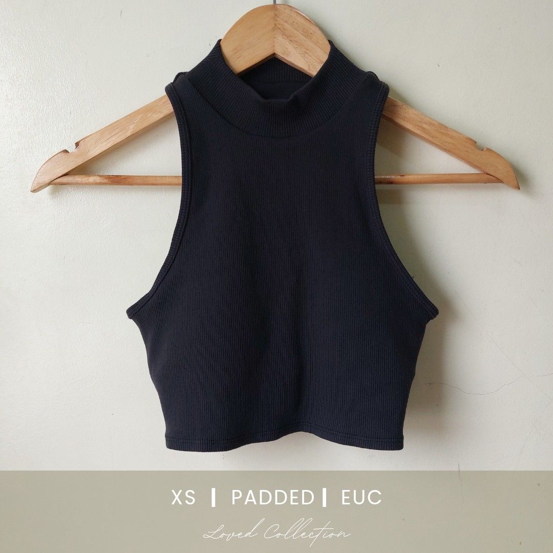 Alo Yoga Rib cropped (Category: Sleeveless) located in Quezon City. Submitted by lovedcollection_2020 (Listing ID 1469118127, Image 1). Description: - Color: Black - Size: Extra Small (XS) - Style: Ribbed crop top with high mock neck and sleeveless cut - Feature: Built-in padding (no bra needed) - Fit: Fitted silhouette, stretchy fabric - Condition: Excellent.