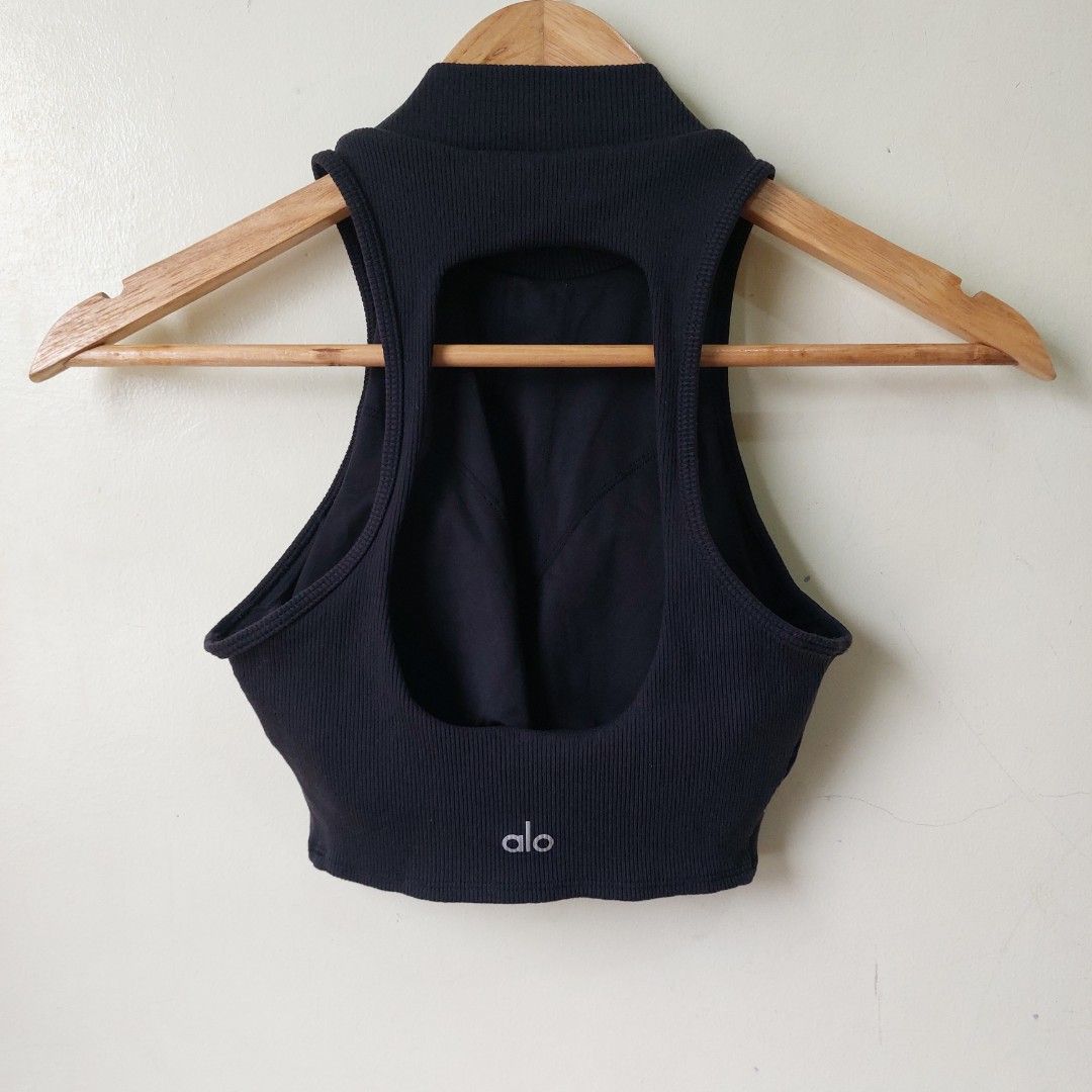 Alo Yoga Rib cropped (Category: Sleeveless) located in Quezon City. Submitted by lovedcollection_2020 (Listing ID 1469118127, Image 2). Description: - Color: Black - Size: Extra Small (XS) - Style: Ribbed crop top with high mock neck and sleeveless cut - Feature: Built-in padding (no bra needed) - Fit: Fitted silhouette, stretchy fabric - Condition: Excellent.