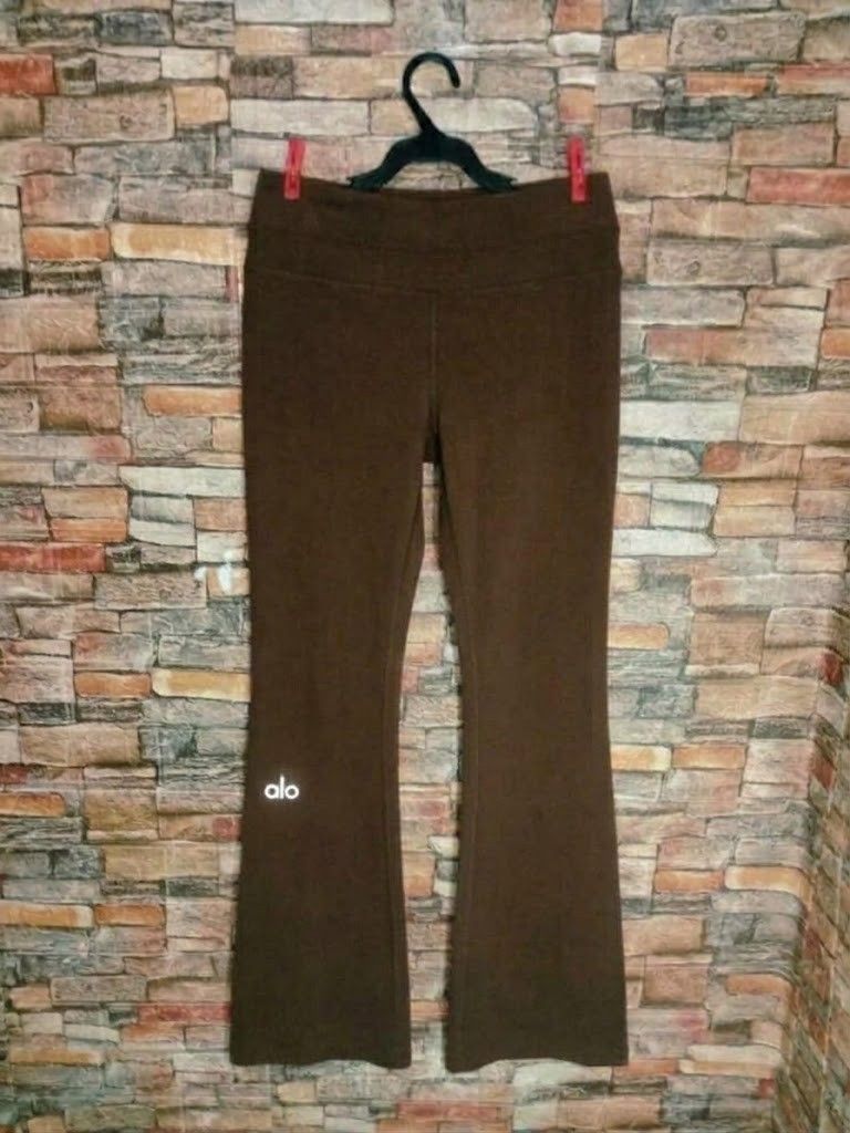 Alo Yoga Brown Flared Pants (Size small) (Category: Activewear) located in Manila. Submitted by liz_gatz (Listing ID 1468953055, Image 2). Description: - Brand: Alo Yoga - Style: Flared lounge pants - Color: Brown - Features: Adjustable drawstring waistband, small white alo logo near the right ankle - Condition: Good overall - Ideal for: Workouts or relaxing at home.