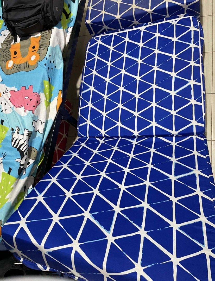 Amelie Sofa Bed 5.5x30x73 Blue Triangle Pattern (Category: Sofas) located in Mandaluyong City. Submitted by trisha_001 (Listing ID 1468976970, Image 2). Description: - Amelie Folding Sofa Bed (Blue with white triangle geometric pattern) - Dimensions: 5.5" x 30" x 73" - Versatile 2-in-1 design: Easily converts from a chair to a flat sleeping mat - Comfortable foam cushion core with a convenient removable printed cover - Ideal space saver for small
