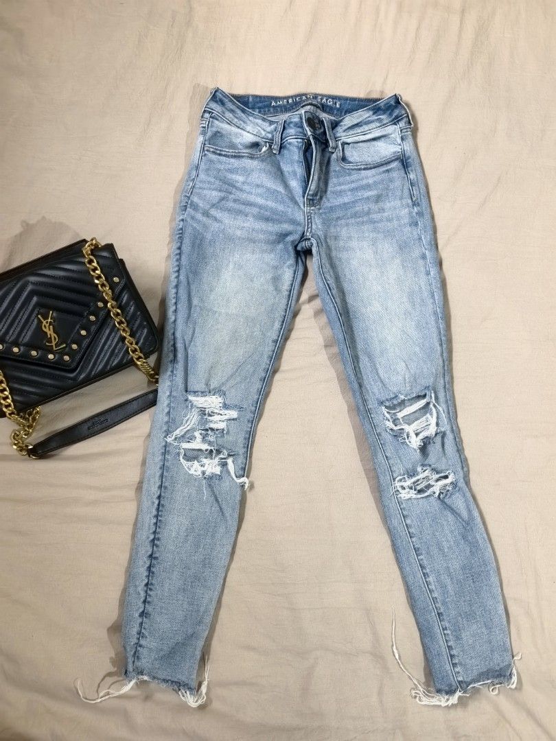 American Eagle Super Stretch Distressed Light Wash Jeans Size 2 Short (Category: Jeans) located in Tacloban City. Submitted by thead.declutters (Listing ID 1469084208, Image 1). Description: - Brand: American Eagle - Size: 2 Short (Mid-rise waist) - Color/Wash: Light blue - Material: Super soft (98% cotton, 2% elastane) - Details: Distressed knee rips and raw frayed hems - Condition/Style: Great casual everyday staple.