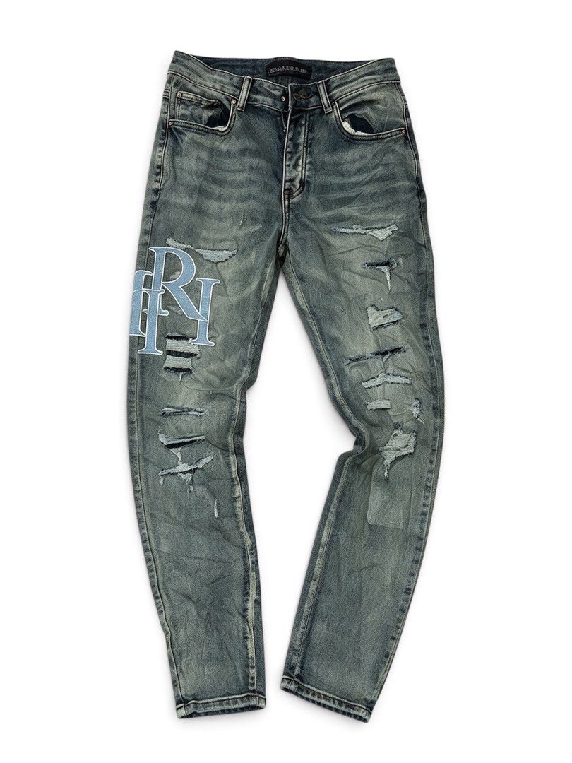 Amiri Distressed Denim Jeans Size 30 (Category: Jeans) located in Manila. Submitted by jerms.thriftah (Listing ID 1469043758, Image 1). Description: - Brand: Amiri - Style: Washed denim jeans with unique green-blue tint - Size: 30 (label inside) - Condition: Brand new with hang tag still attached at back waistband - Details: Distressed throughout the legs, large embroidered 'AM' lettering on the right back leg, and 'RI' patch on the front right.