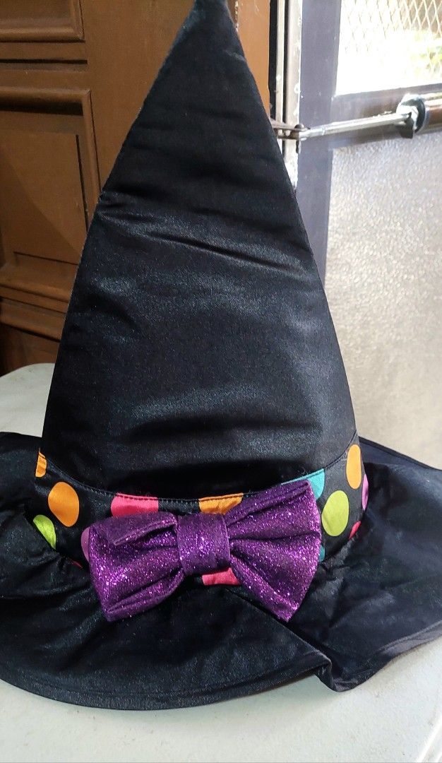 Amscan Miss Mapped Witch Hat for Kids (Category: Hats & Beanies) located in Baguio. Submitted by ayra1523 (Listing ID 1469013662, Image 3). Description: - Brand: Amscan - Material: Black satin with colourful polka dot band - Feature: Sparkling purple bow in front - Size: 4-6 years (height up to 110cm) - Care: Hand wash only - Perfect for Halloween and dress-up play.